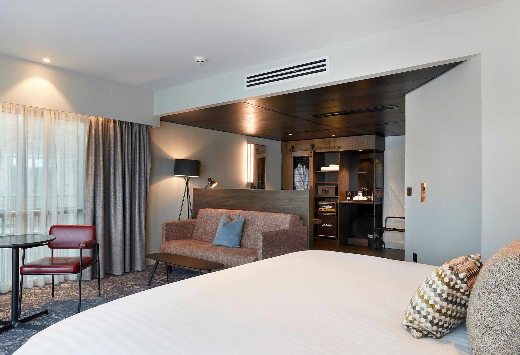 Scalable, consistent hotel IT across multiple sites body image showing a hotel room