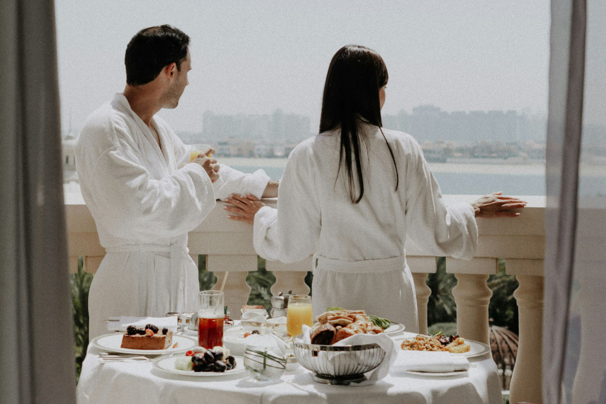 What is managed IT support for hotels? FAQs for hotel operators body image showing guests on a hotel balcony
